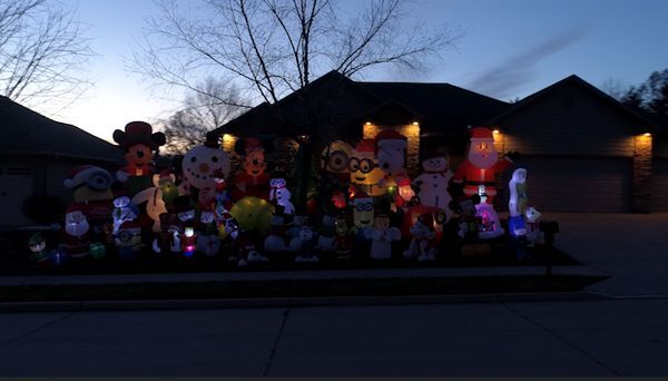 EmVP Family packs lawn with 50 Christmas inflatables